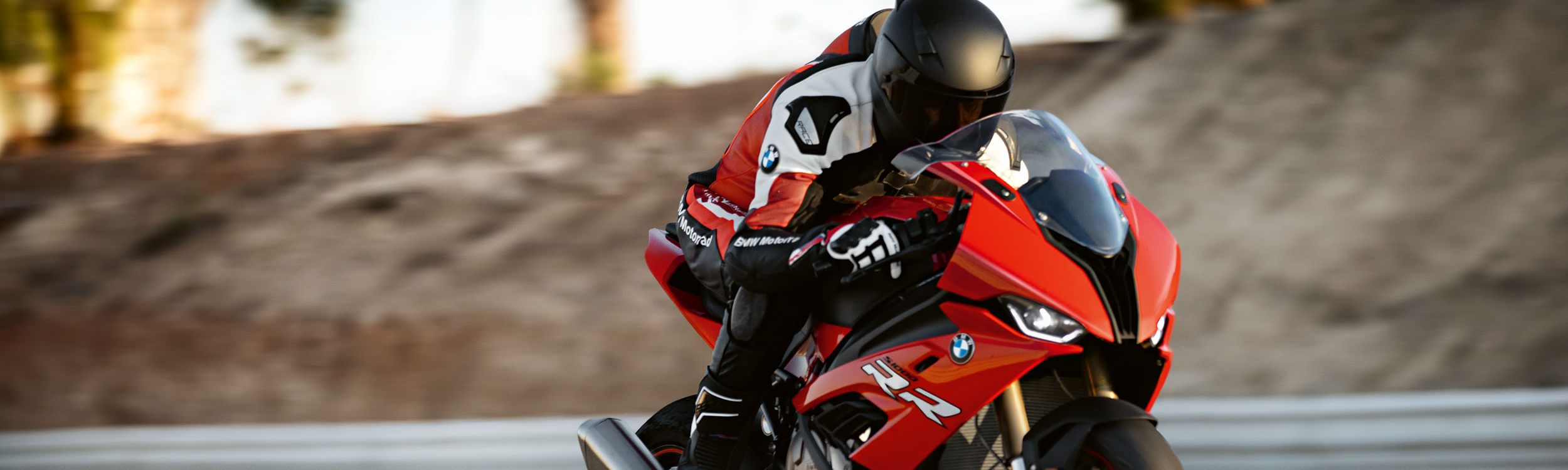 Motorcycle rider on a bmw motorcycle riding on track